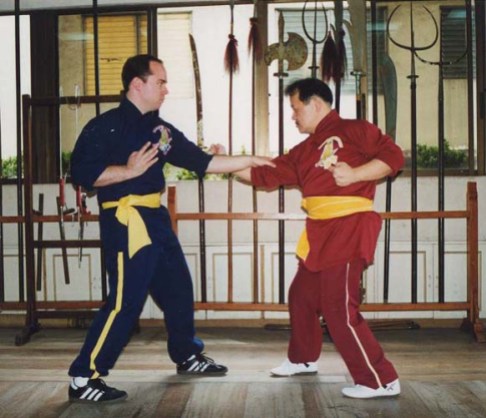 Dr. Mark Wiley and GM Alex Co performing the two-man set of Sang Sau Kun.